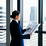 **

"A professional architect, fully clothed in a stylish yet modest business casual outfit, reviewing blueprints in a brightly lit, modern architectural office. Large windows offer a view of a bustling cityscape. The scene is safe for work, appropriate content, professional, perfect anatomy, correct proportions, well-formed hands, proper finger count, natural body proportions, high-resolution, detailed textures."

**